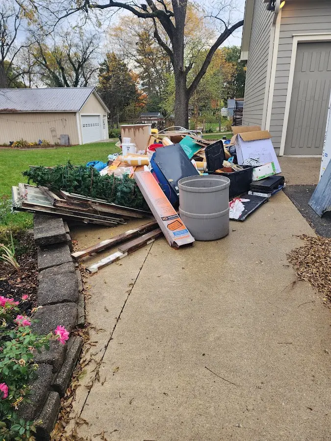 Dumpster being loaded with debris for 30 Yard Dumpster Rental in Bristol